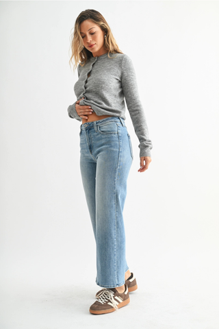 Just Black BP239J The Slim Wide Leg Woman wearing a gray sweater and light blue jeans on a white background