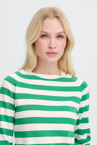 Woman wearing a green and white striped sweater on a plain background BYMmorla Long Cuff Tee