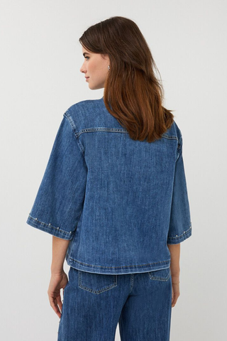 EsQualo SP2612016 Denim Blouse with Studs Woman wearing a blue denim jacket and pants on a white background
