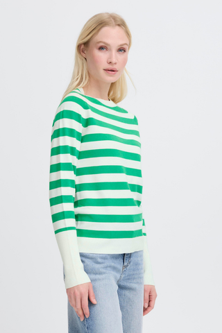 Woman wearing a green and white striped sweater on a plain background BYMmorla Long Cuff Tee