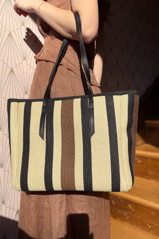 Leo & Ugo KEBH088 Neutral Striped Hat & Bag Combo  Person holding a striped tote bag with a patterned background