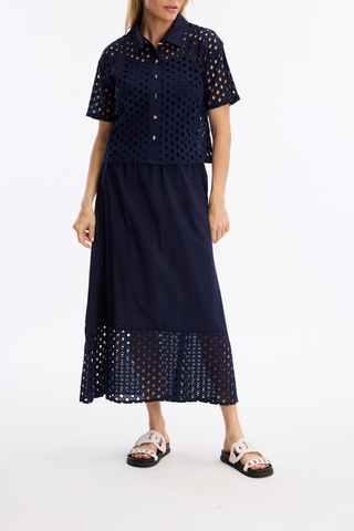 Leo & Ugo JE924 Laura Openwork Short Sleeve Blouse Woman wearing a navy blue outfit with lace details on a white background