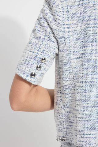 Lyssé 24-3834-M2 Lily Summer Tweed Jacket  Close-up of a textured shirt with rolled-up sleeves on a plain background