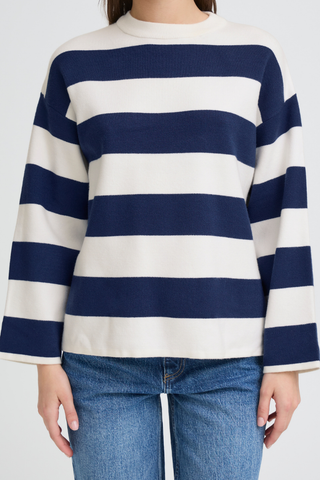 Navy and white striped sweater worn by a person on a plain background b. young BYOtari Stripe Sweater
