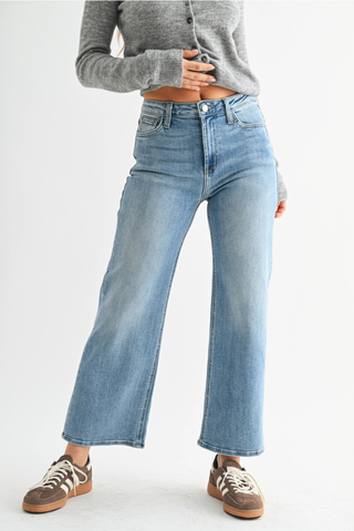 Just Black BP239J The Slim Wide LegPerson wearing light blue jeans and a gray cropped sweater on a white background
