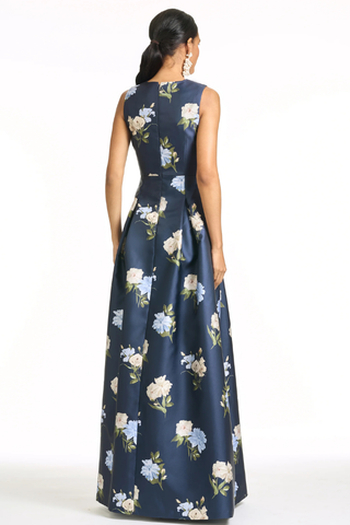 Sachin & Babi Brooklynne Gown - Maritime Corsage S262G24-411 Woman wearing a navy blue floral dress on a white background