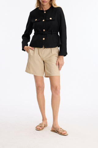 Leo & Ugo KE376 Salomé Elegant Belted Jacket - Black Woman wearing a black jacket with gold buttons and beige shorts on a white background