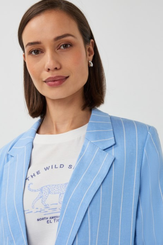EsQualo SP2628002 Striped Linen Blazer  Woman wearing a light blue pinstripe blazer over a white graphic t-shirt on a plain background