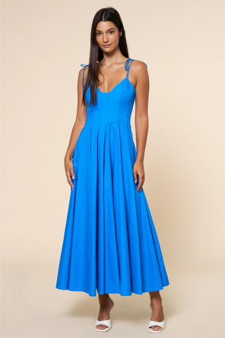 lalavon ILD6722 Fit & Flare Shoulder Tie Straps Maxi Dress  Woman wearing a blue dress against a beige background