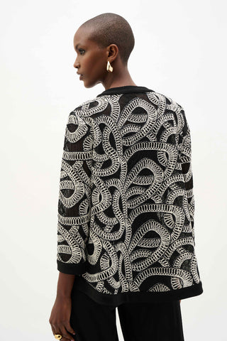 Ribkoff 262207 Novelty Mesh Abstract Print Swing Jacket Person wearing a black and white patterned jacket on a white background