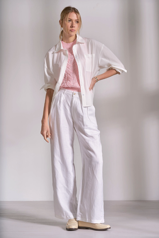 Elan PL11631 Oversized Back Pleated Shirt  Woman wearing a white outfit with a light pink top and pants against a plain background