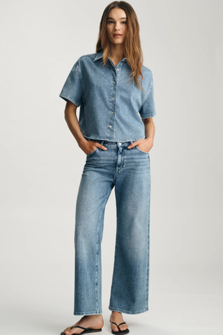 Mavi Jessie Denim Shirt M1217143 Woman wearing a denim shirt and jeans on a plain background