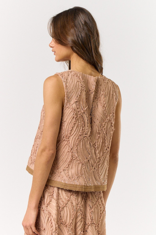lalavon ILT5200 Mocha Textured Sleeveless Blouse  
Woman wearing a patterned sleeveless top and skirt set on a white background