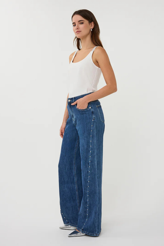 EsQualo SP2612018 Wide Fit Trouser Jeans with StudsWoman wearing a white tank top and blue jeans on a white background