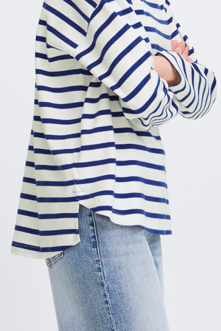 Person wearing a blue and white striped shirt with a plain background b young BYRamsi Pullover