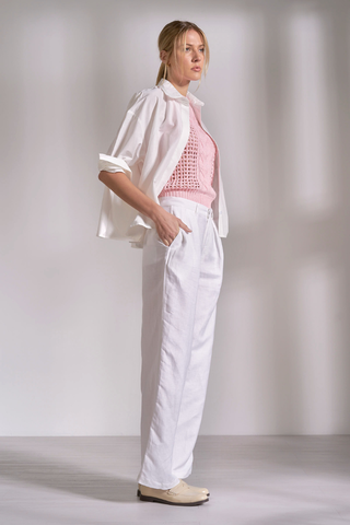 Elan PL11631 Oversized Back Pleated Shirt  Woman wearing a white blouse, pink top, and white pants against a plain background