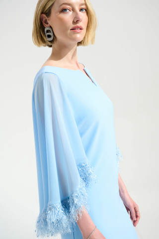 Ribkoff 261715 Signature | Silky Knit A-Line Dress With Chiffon Cape And Novelty Trim  Woman wearing a light blue dress with lace details on a plain background
