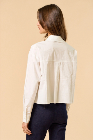 lalavon ILT6382 Off White Floral Appliqué Button Down Shirt  Woman wearing a white shirt and dark pants on a beige background