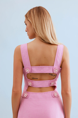 Leo & Ugo KER063 Nina Open Back Midi Dress Person wearing a pink denim dress with button details on a light blue background