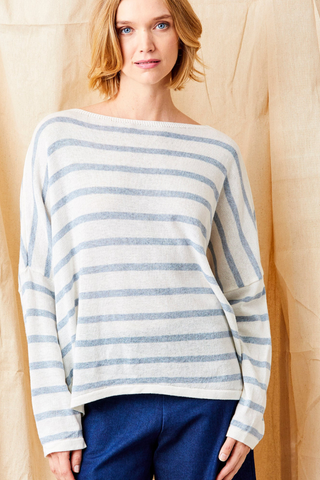 Suzy D Fayola Oversize Stripe Hi Lo Hem Knit  Woman wearing a striped sweater against a plain background