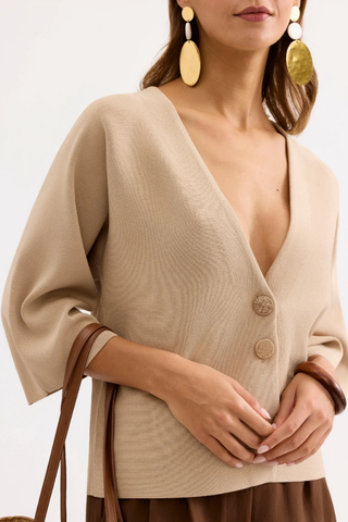 Leo & Ugo AE128 Marie Structured V-Neck Top with Wide Sleeves Beige cardigan worn by a person with gold earrings on a white background