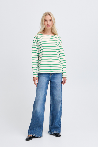 BYRamsi Striped Long Sleeve Pullover Leprechaun Stripe Woman wearing a green and white striped sweater and blue jeans on a white background