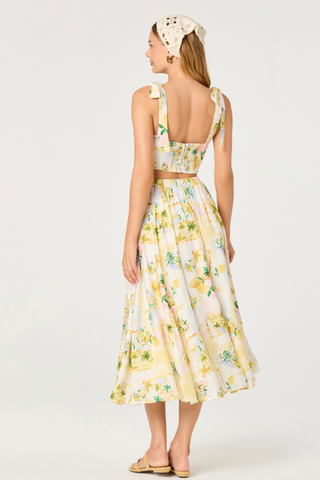 Woman wearing a yellow floral dress on a white background ASTR Kaleigh Skirt