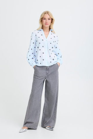 Woman wearing a white blouse with black patterns and gray wide-leg jeans on a white background b. young BYFabienne Long Sleeve Shirt