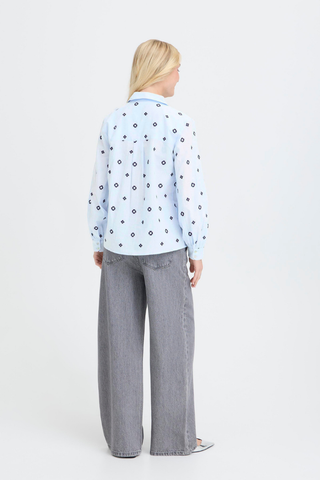 Person wearing a light blue floral blouse and gray pants on a white background b. young BYFabienne Long Sleeve Shirt