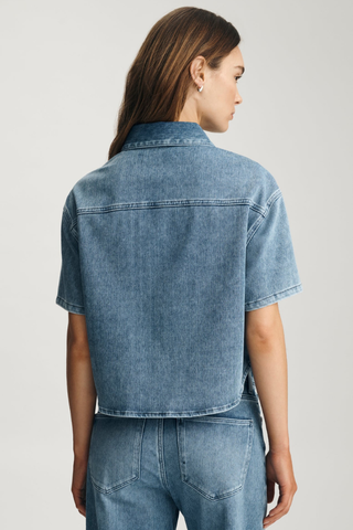 Mavi Jessie Denim Shirt M1217143 Person wearing a blue denim shirt and jeans on a light gray background