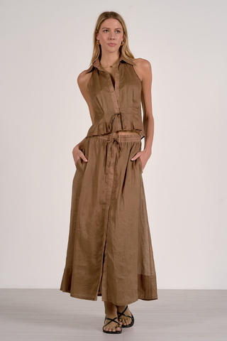 Elan RA11634  Woman wearing a brown sleeveless dress with a belt on a white background