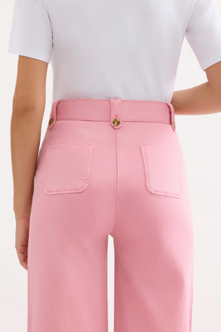 Leo & Ugo VEP201 Alina Wide High Waisted Jeans Person wearing pink pants with a white top on a light background