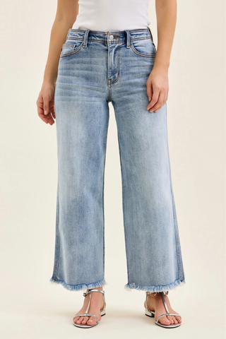 Judy Blue Mid Rise Ankle Hollywood Waistband Fray Hem Wide Leg Denim 82728REG Light blue jeans worn by a person on a white background