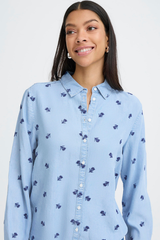 Woman wearing a light blue shirt with small patterns on a plain background b. young BYKosmo Boho Embroidered Shirt