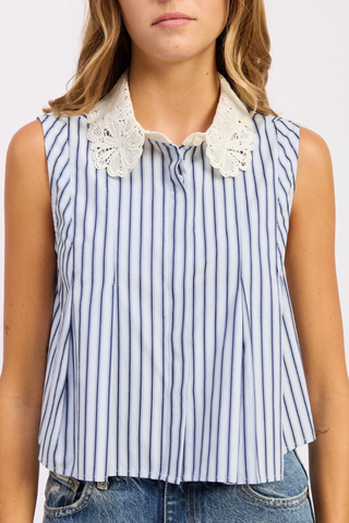 Woman wearing a sleeveless striped shirt with lace collar on a white background En Saison Clara Striped Sleeveless Top with Eyelet Collar