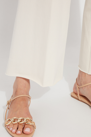 Erin Wide Leg Denim 10-3209-M9-OAT Beige sandals with gold chain detail worn with white pants on a light gray background