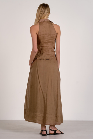 Elan RA11634  Woman wearing a brown dress against a white background