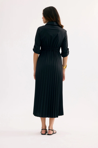 Leo & Ugo EER620 LAETITIA Black Tie-Waist Midi Shirt Dress Woman wearing a black dress standing against a white background