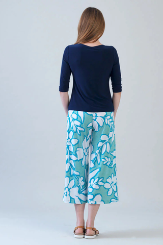 Clara Sunwoo Scoop Neck Half Sleeve Top - Navy T77 Woman wearing a navy top and blue floral pants on a white background