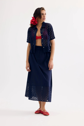  Leo & Ugo JE924 Laura Openwork Short Sleeve Blouse Woman wearing a navy outfit with red accents on a white background