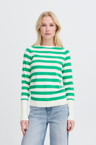 Woman wearing a green and white striped sweater with light blue jeans on a gray background BYMmorla Long Cuff Tee
