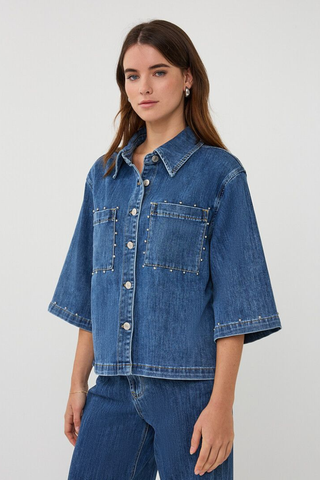 EsQualo SP2612016 Denim Blouse with Studs Woman wearing a blue denim jacket and jeans on a white background