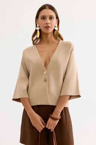 Leo & Ugo AE128 Marie Structured V-Neck Top with Wide Sleeves Woman wearing a beige top with a V-neckline and brown skirt on a white background