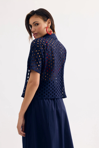 Leo & Ugo JE924 Laura Openwork Short Sleeve Blouse Woman wearing a navy blue outfit with a patterned top on a white background