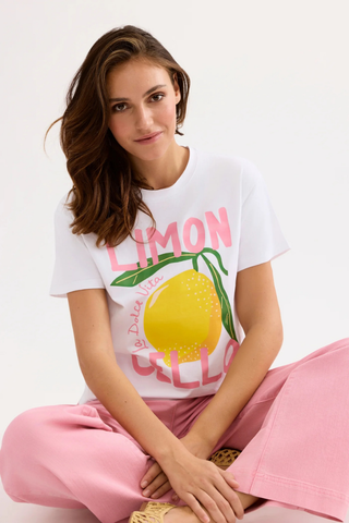 Leo & Ugo TEK074 Lennon Lemon Printed T-Shirt Woman wearing a white t-shirt with a lemon graphic and text, sitting on a white background