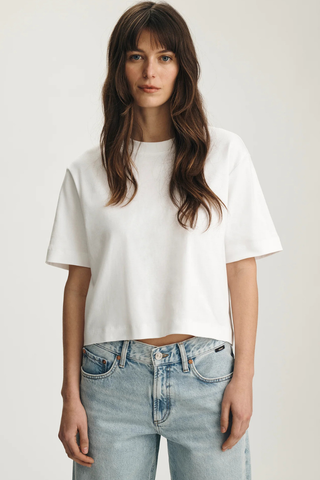 Mavi M1613686-620 Riley Crew Neck T-Shirt  Woman wearing a white t-shirt and light blue jeans on a plain background