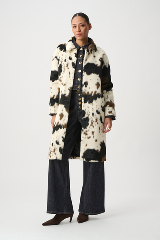 Ribkoff 264944 Faux Fur Cow Print Coat Person wearing a long, patterned coat on a white background