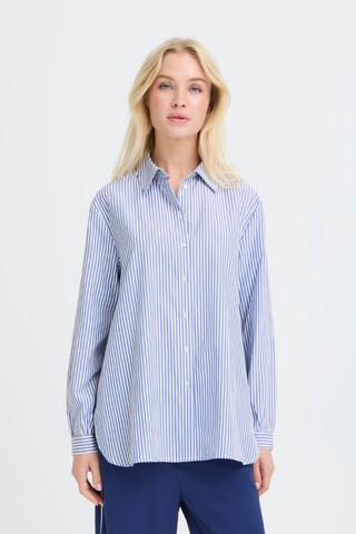 Woman wearing a blue and white striped shirt against a light gray background b. young BYHanio Tape Shirt