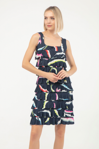 Isle Square Neck Cha Cha Dress Sealife Woman wearing a navy dress with colorful feather pattern on a white background